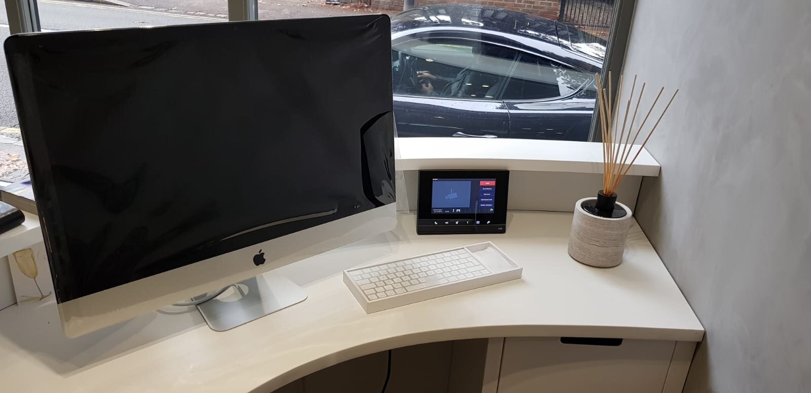 View of desk with iMac and tablet