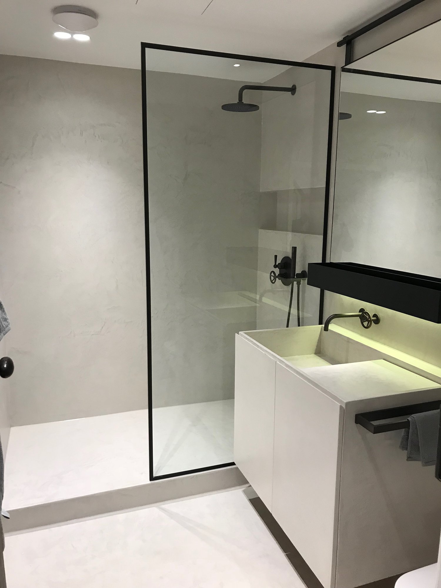 Modern bathroom with glass shower screen and spotlights