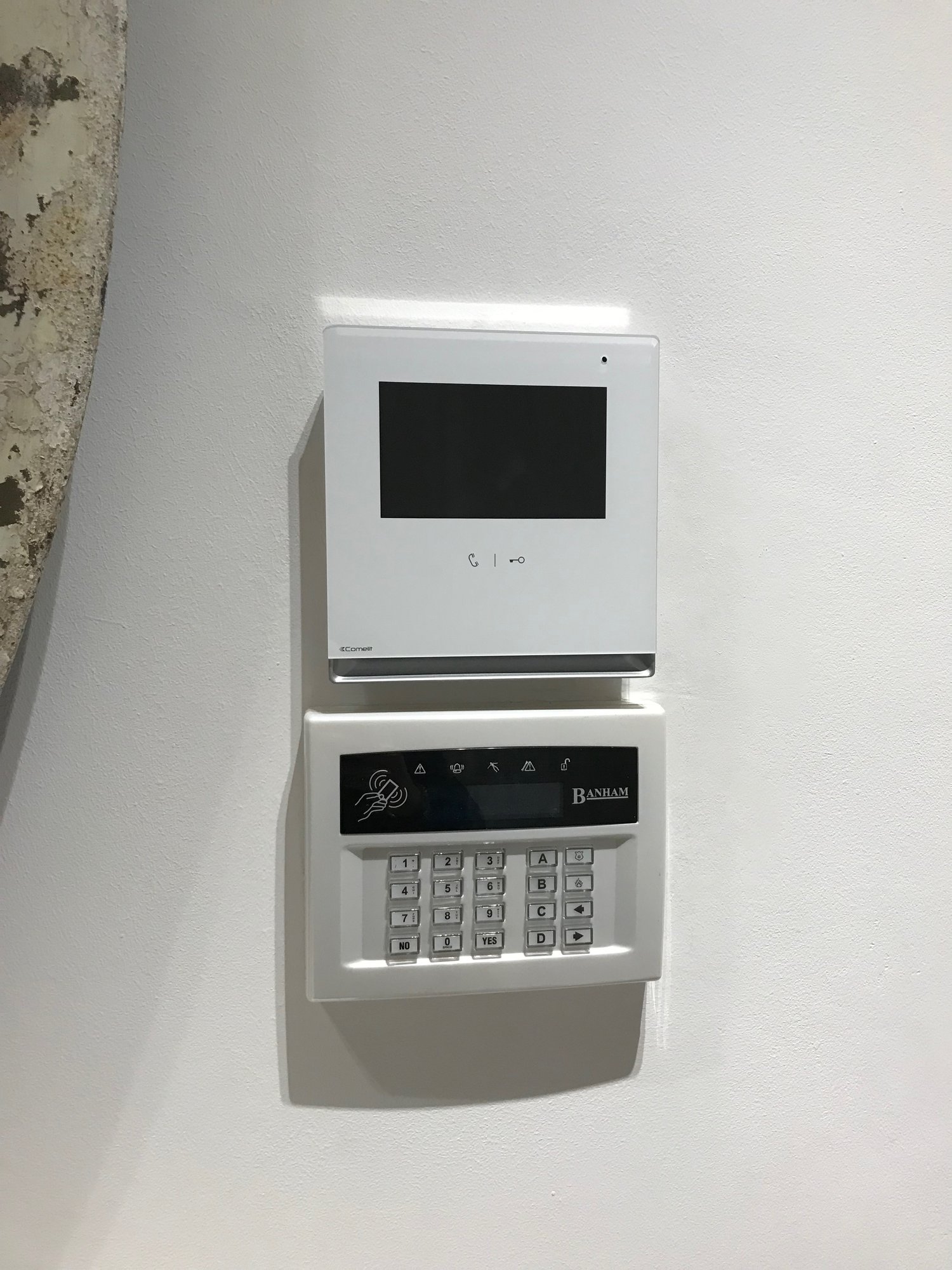 Texecomm alarm panel and a comelit alarm panel