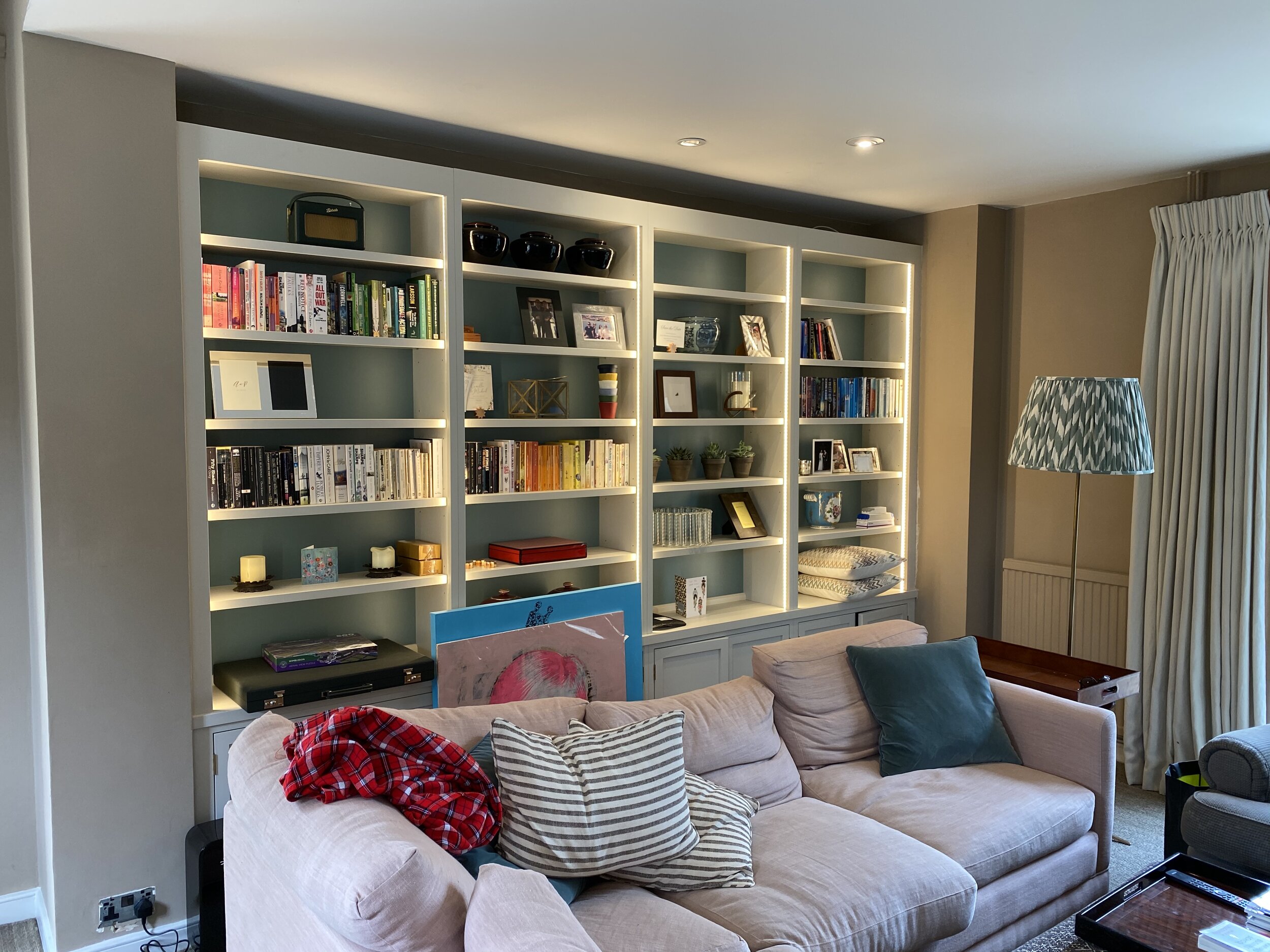 Interior of a living room with built in bookcases and LED downlights