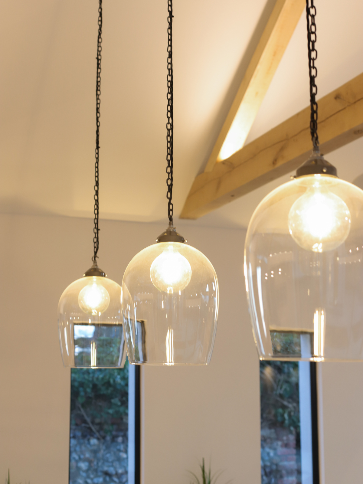 Three lighting pendants hanging from the ceiling